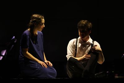 Intimate spotlit duet scene from Spring Awakening